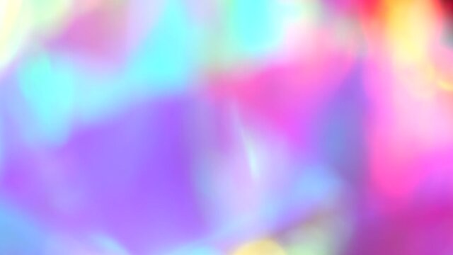 Laser neon red and blue light rays flash and glow. Light show. Optical Crystal Prism Beams. Blurred pink 
purple rainbow abstract background