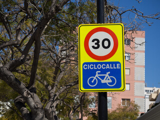 Speed ​​limit and caution traffic sign bike lane