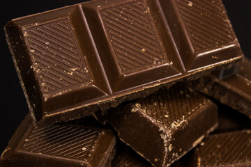 chocolate bars on wooden table top view