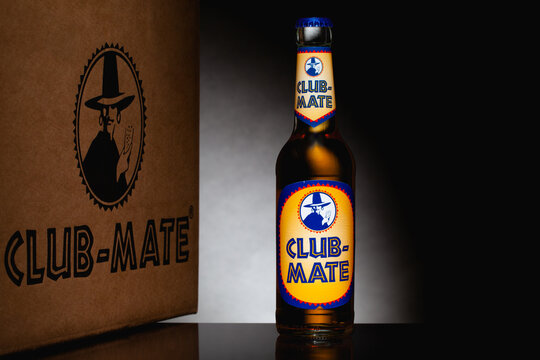 Club-Mate bottle on the glass table.