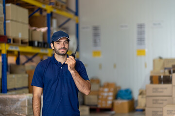 Male factory worker with working in the industry factory warehouse and talking with communication...