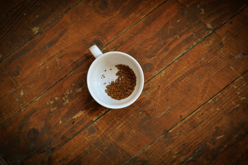 Brewed coffee cup on brown background