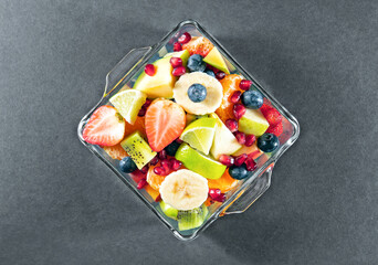Portion fruit salad in a bowl . Healthy meal