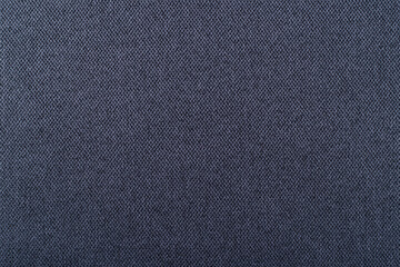 Fototapeta na wymiar smooth surface of dense upholstery fabric of dark blue color, background, texture