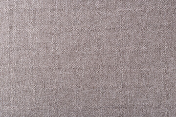 smooth surface of light brown dense upholstery fabric with linen texture, background