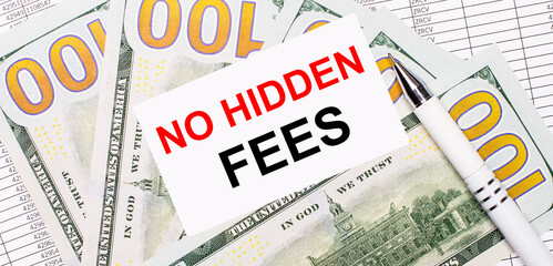 Against the background of reports and dollars - a white pen and a card with the text NO HIDDEN...