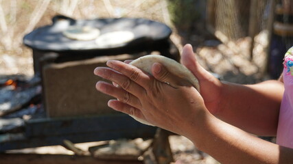 person holding tortila