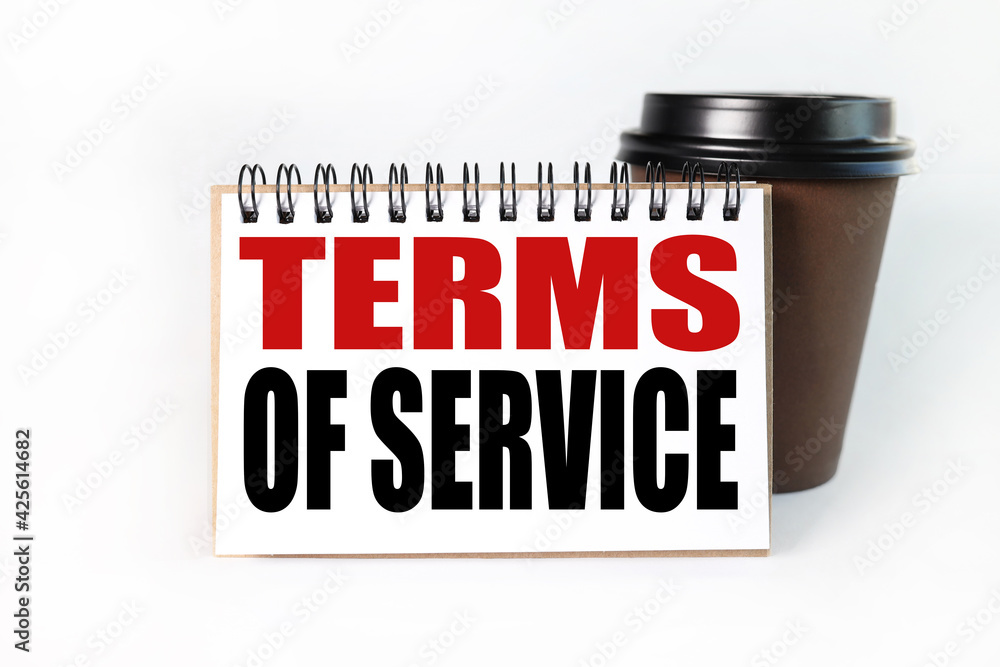 Fototapete term of service. text on white notepad paper on light background