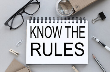 Know The Rules. text on white paper on gray background