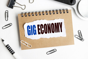Gig EconomY. text on white paper on notepad on white background