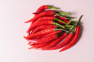 A slide of red chili peppers on a light background.
