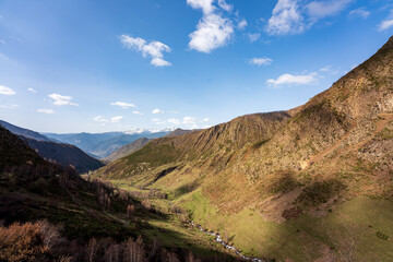 Naklejka na ściany i meble Panoramic views of the Unarre valley, from the Gola pond. Sunny day with some clouds, early spring.