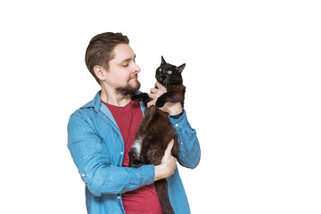 a young Caucasian man with a beard holds a black cat on a white isolated background