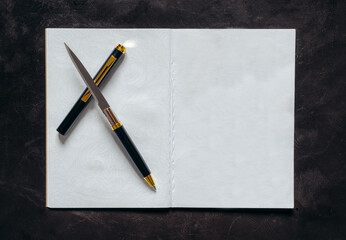 Pen-Knife on a blank notebook paper
