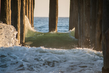 Waves crash against Manhattan Beach pier