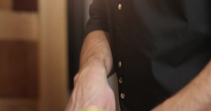 close-up chef's face and hands slicing apples. bearded chef cooks.