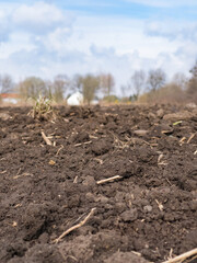 Arable land. Preparing field for planting. Plowed soil in spring time . Agricultural work.