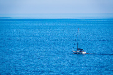 Fototapeta premium Sailing yacht in the blue calm sea.