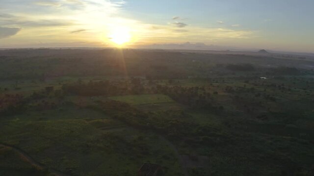 Sun rise drone shot over an African village.