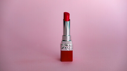 red lipstick on pink background