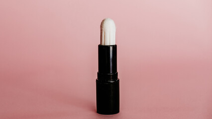 tampon in a lipstick on background menstrual vaginal product for women