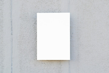 Blank minimal mockup poster on gray stone wall