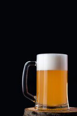 Wheat beer mug on black background, copyspace