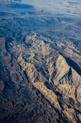 aerial view of desert mountains and canyon. Rocky geological formations. Arabian Peninsula