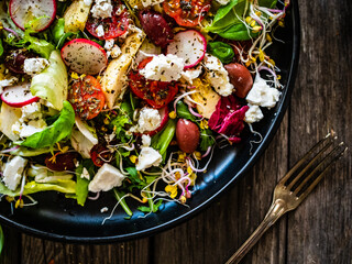 Fresh vegetable salad - feta cheese, tomatoes, radish, artichokes , lettuce, black olives and...