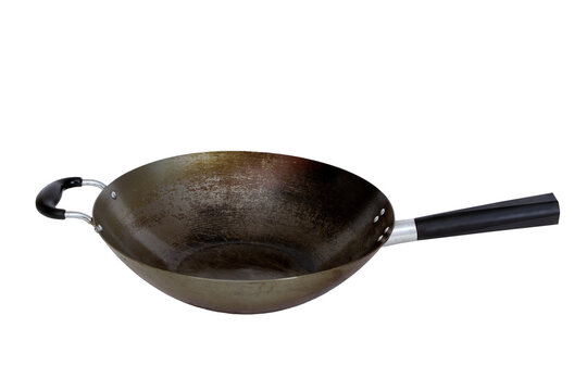 Side View Of A Used Empty Carbon Steel Wok With Handles