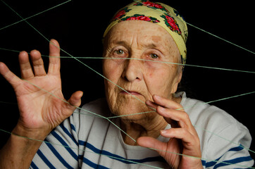 The woman got entangled in the threads. The man is trying to get out of the strings. Unravel the...
