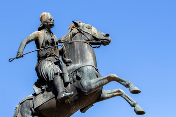 Naklejka premium close-up of the equestrian statue of George Karaiskakis in Athens, Greece. He was General of the Greek Revolution of 1821. Sunny day with blue sky