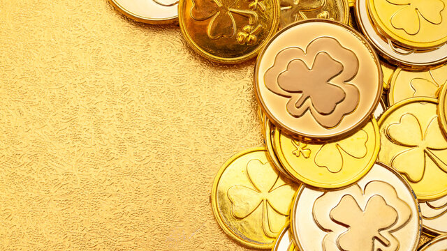 St Patrick's Day and gold treasure concept with full fame image of golden coins with copy space
