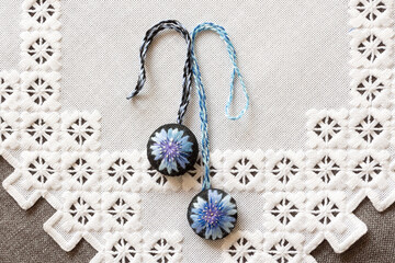 hand-embroidered keychains on a napkin