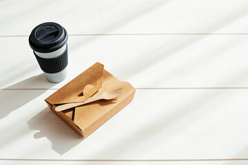 Hot coffee on the go and lunch box. Biodegradable, disposable takeaway food box and reusable coffee, tea cup, eco friendly alternative lifestyle