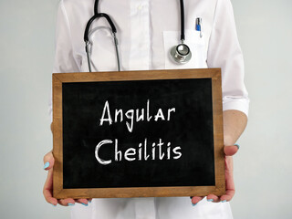 Medical concept about Angular Cheilitis with phrase on the piece of paper.