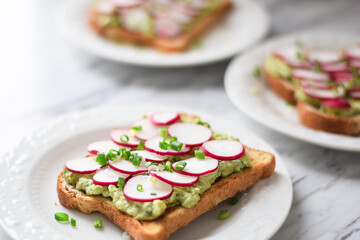 Healthy avocado toast with radishes