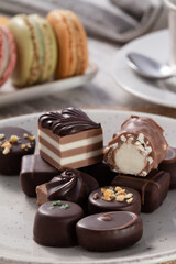 close up view of an assortment of artisan chocolates on a plate