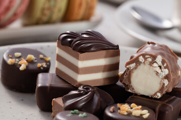 close up view of an assortment of artisan chocolates on a plate