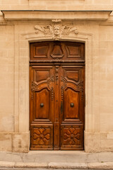 Avignon, an old wooden door, typical building in the south of France
