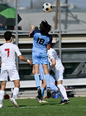 Young athletic boy making amazing plays during a soccer match