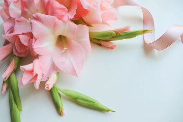 greeting card design. beautiful bouquet of pink gladioli and space for text 