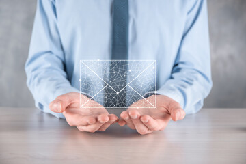 Businessman hand holding e-mail icon, Contact us by newsletter email and protect your personal...