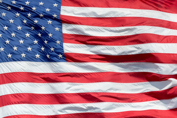Closeup of an United States American flag waving in a strong wind