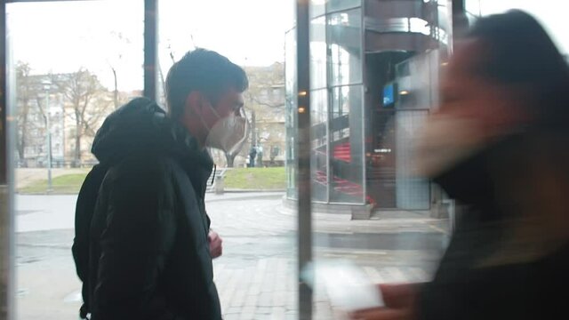 The guy in the mask moves near the window. Moving the passenger in the lobby. Moving around the city.