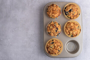 Delicious crumble muffins in baking form