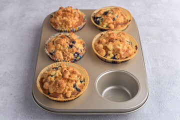 Delicious crumble muffins in baking form