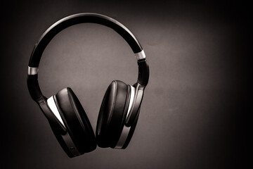 Fototapeta na wymiar stylish headphones and music. white and black background