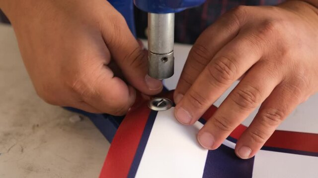 Close up hand press eyelet machine and eyelets details