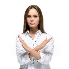 Serious confident woman holding two arms crossed, gesturing no sign. Isolated on white background